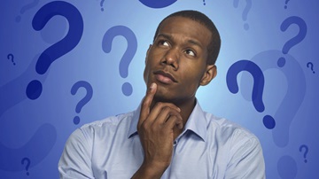 Thoughtful man with question-marks in background